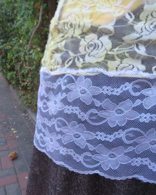 Adorable acrylic lace long empire cross over top in yellow and cream with strappy top.Size 38/14.