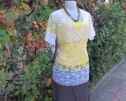 Adorable acrylic lace long empire cross over top in yellow and cream with strappy top.Size 38/14.