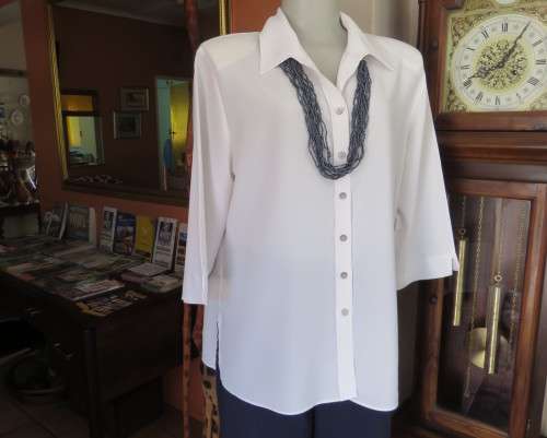 Classic white button down blouse with open collar and elbow length sleeves.Size 40/16.WOOLWORTHS