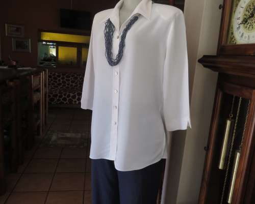 Classic white button down blouse with open collar and elbow length sleeves.Size 40/16.WOOLWORTHS
