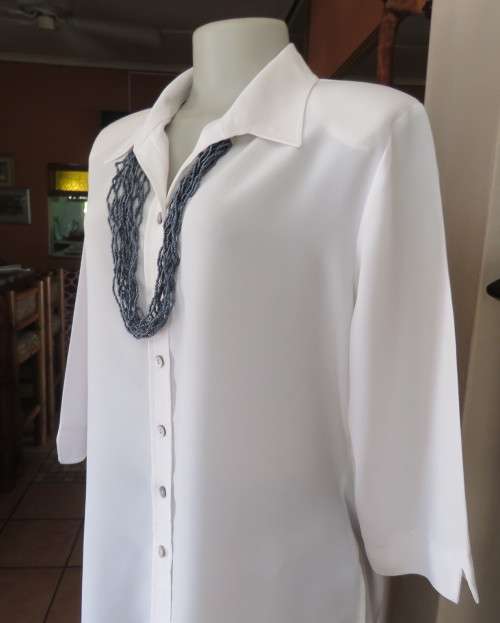 Classic white button down blouse with open collar and elbow length sleeves.Size 40/16.WOOLWORTHS