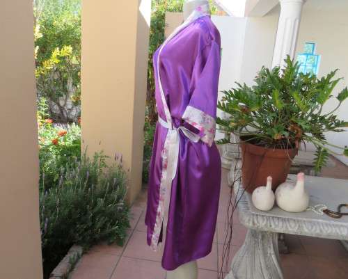 Cool purple short sleeve silky polyester fold over night gown. Silver with bird pattern edging.XL