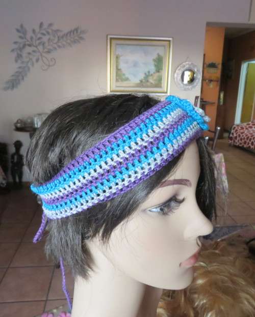 Pretty crochet acrylic hairband in purple/grey/blue stripes with flower.Purple braiding ties at back