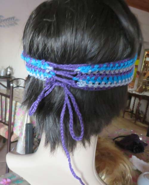 Pretty crochet acrylic hairband in purple/grey/blue stripes with flower.Purple braiding ties at back