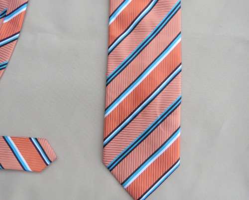 Beautiful textured polyester coral/blue/white neck tie. Width 8.5.By CIGNAL.Diagonal stripes.As new