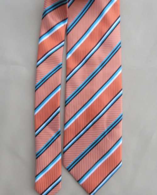 Beautiful textured polyester coral/blue/white neck tie. Width 8.5.By CIGNAL.Diagonal stripes.As new