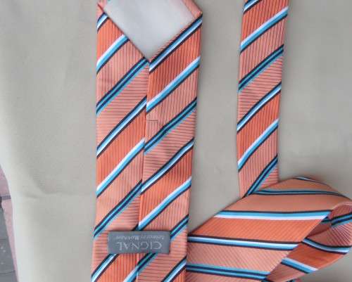 Beautiful textured polyester coral/blue/white neck tie. Width 8.5.By CIGNAL.Diagonal stripes.As new