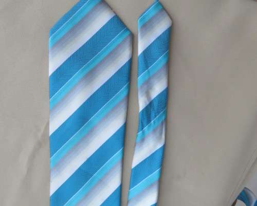 Beautiful diagonal striped neck tie in shades of jade and cream. Width 8.5cm. By SIGNATURE. As new