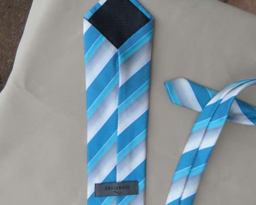Beautiful diagonal striped neck tie in shades of jade and cream. Width 8.5cm. By SIGNATURE. As new