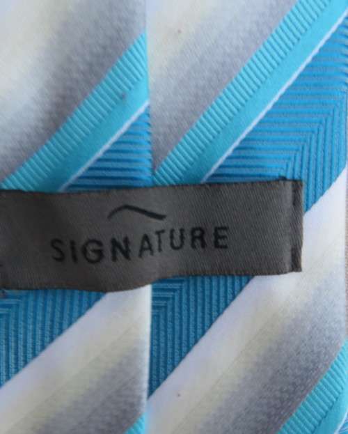 Beautiful diagonal striped neck tie in shades of jade and cream. Width 8.5cm. By SIGNATURE. As new