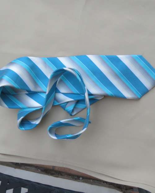 Beautiful diagonal striped neck tie in shades of jade and cream. Width 8.5cm. By SIGNATURE. As new