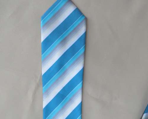 Beautiful diagonal striped neck tie in shades of jade and cream. Width 8.5cm. By SIGNATURE. As new