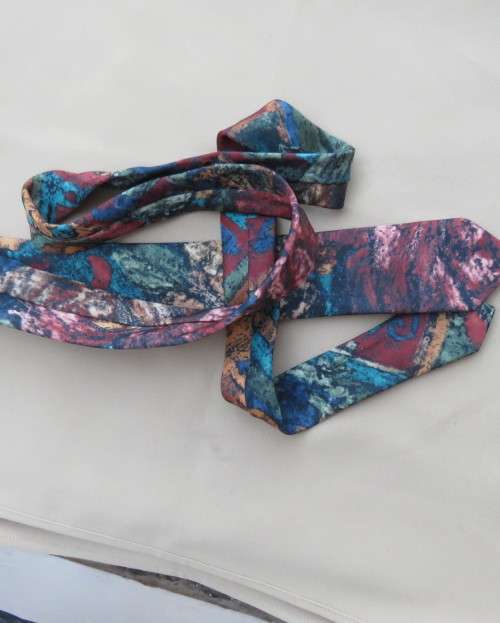 Modern narrow silky polyester neck tie in array of beautiful colours. Width 5cm. New condition