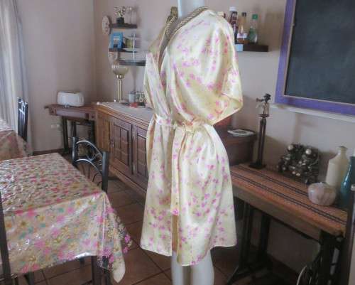 As new vanilla yellow silkyfold over night gown with pink/white flowers.Tiny cut-on sleeves.Size 42