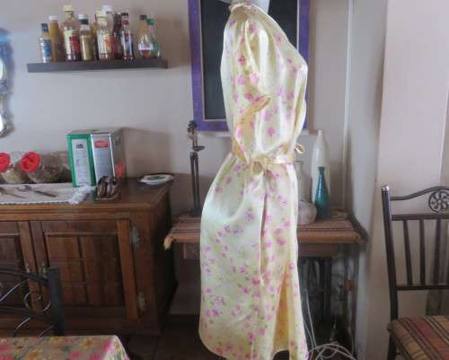 As new vanilla yellow silkyfold over night gown with pink/white flowers.Tiny cut-on sleeves.Size 42