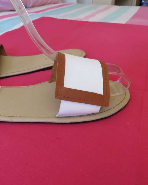 Comfy pair slip-on`s in size 8 by AUDACITY. With wide tan/cream strap over foot. New condition