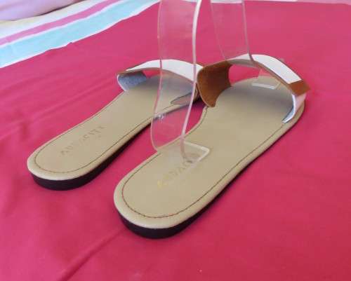 Comfy pair slip-on`s in size 8 by AUDACITY. With wide tan/cream strap over foot. New condition