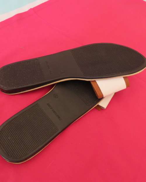 Comfy pair slip-on`s in size 8 by AUDACITY. With wide tan/cream strap over foot. New condition