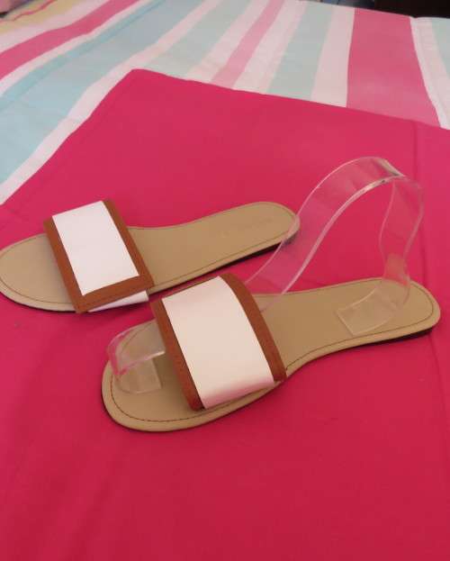 Comfy pair slip-on`s in size 8 by AUDACITY. With wide tan/cream strap over foot. New condition