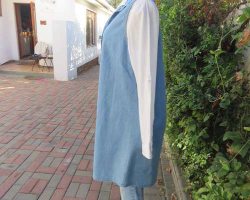 Versatile light blue denim 100% cotton long loose top with hidden button down.Size 38/14.