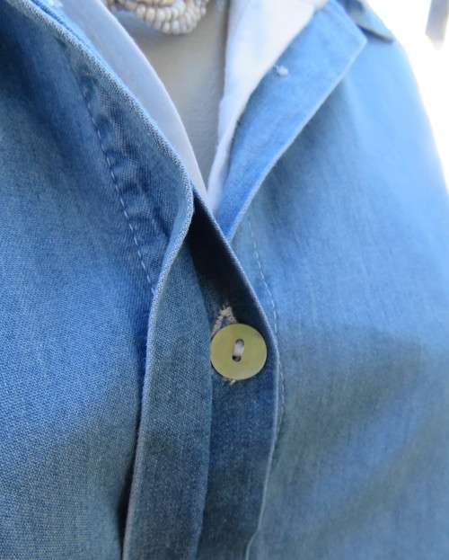 Versatile light blue denim 100% cotton long loose top with hidden button down.Size 38/14.