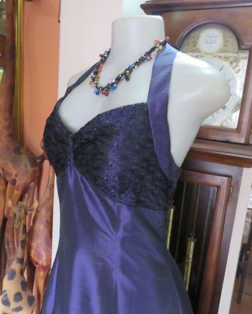 Sexy boutique made eggplant purple satin halter neck dress with black lace decor. Size 34/10.