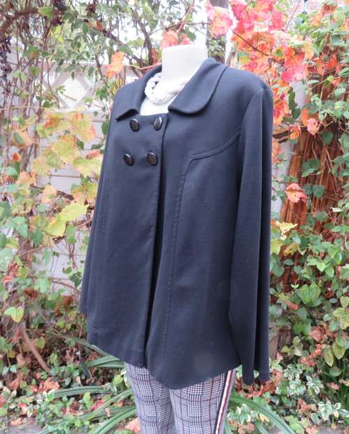 Stunning warm black swing fully lined double breast jacket with rounded collar.Size 48/24 by DONNA-C