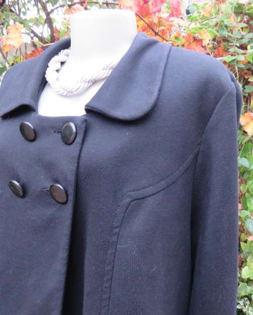 Stunning warm black swing fully lined double breast jacket with rounded collar.Size 48/24 by DONNA-C