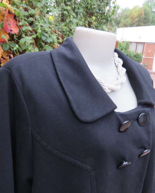 Stunning warm black swing fully lined double breast jacket with rounded collar.Size 48/24 by DONNA-C