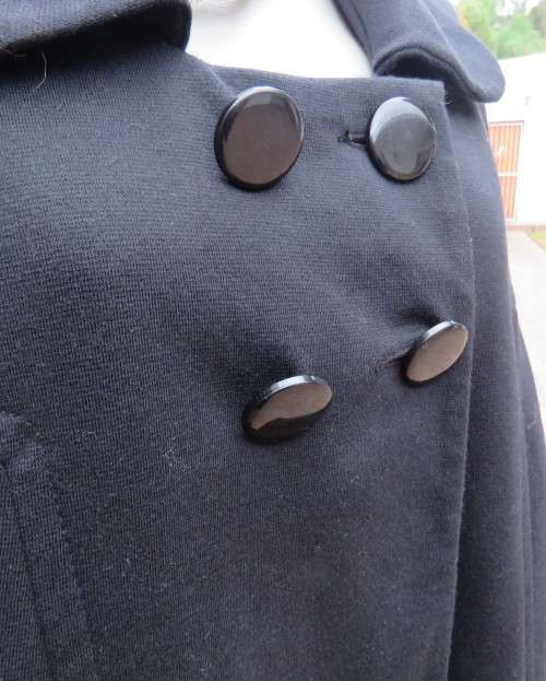 Stunning warm black swing fully lined double breast jacket with rounded collar.Size 48/24 by DONNA-C