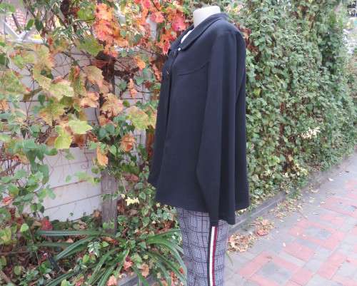 Stunning warm black swing fully lined double breast jacket with rounded collar.Size 48/24 by DONNA-C