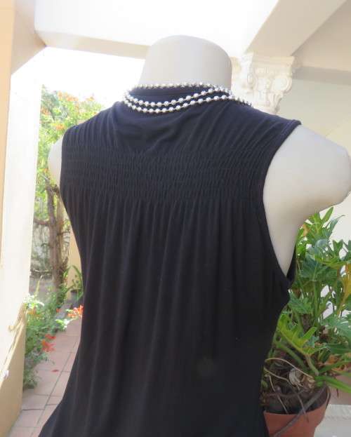 Sexy black viscose stretch sleeveless top with ruched front with buckle. IDENTITY size 38/14.As new