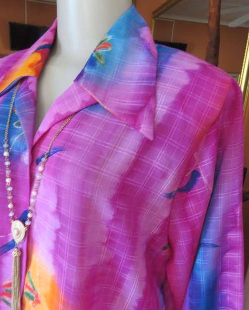 Amazing 2 pc pant suit with violet pants and violet,orange,jade pattened glitter top.Size 42/18.