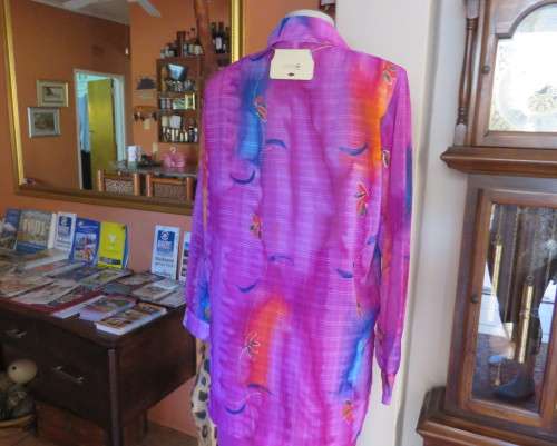 Amazing 2 pc pant suit with violet pants and violet,orange,jade pattened glitter top.Size 42/18.