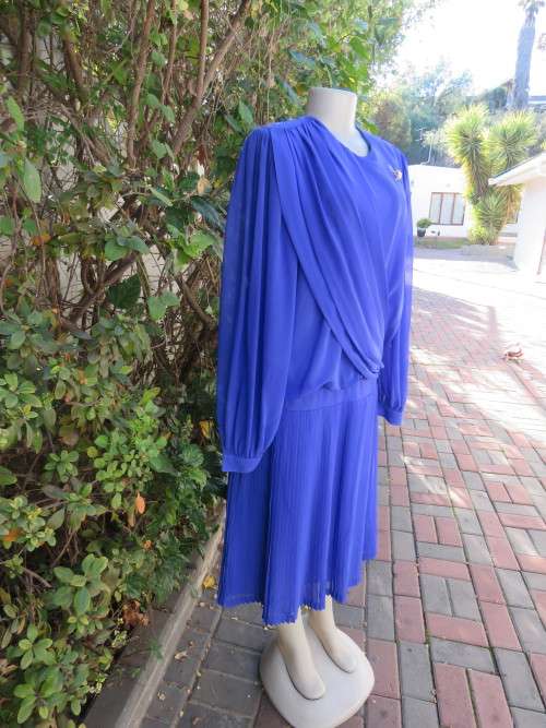 Elegant special occasion royal blue sheer fully lined size 38/14 dress by HELENEL.Pleated bottom.