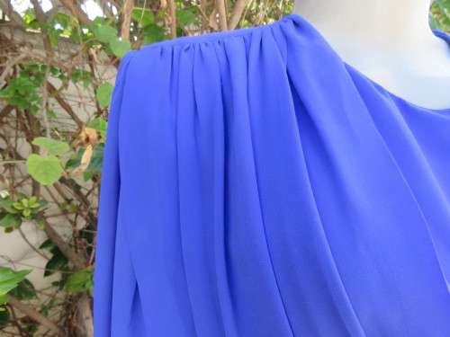 Elegant special occasion royal blue sheer fully lined size 38/14 dress by HELENEL.Pleated bottom.