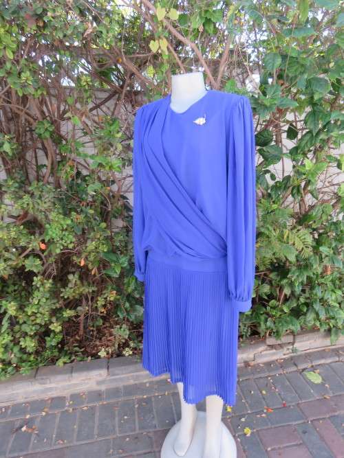 Elegant special occasion royal blue sheer fully lined size 38/14 dress by HELENEL.Pleated bottom.