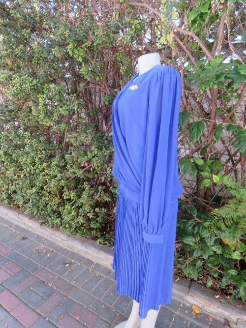 Elegant special occasion royal blue sheer fully lined size 38/14 dress by HELENEL.Pleated bottom.