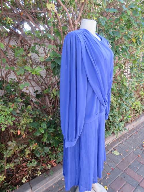 Elegant special occasion royal blue sheer fully lined size 38/14 dress by HELENEL.Pleated bottom.
