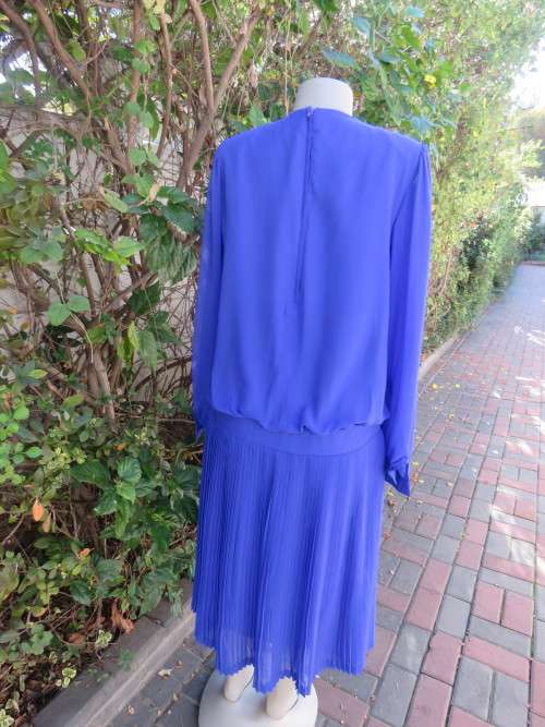 Elegant special occasion royal blue sheer fully lined size 38/14 dress by HELENEL.Pleated bottom.