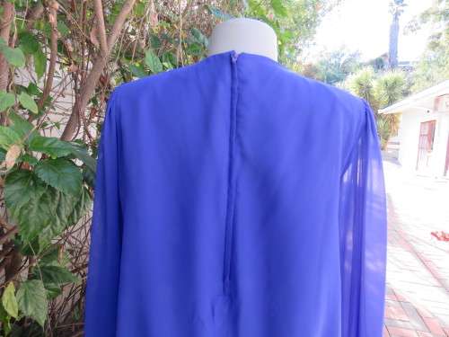 Elegant special occasion royal blue sheer fully lined size 38/14 dress by HELENEL.Pleated bottom.