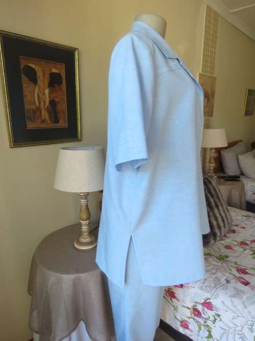 Skyblue 3 pc pant suit. Ankle ants,lace slip over top and short sleeve jacket.Size 40.By SALLY FAYE