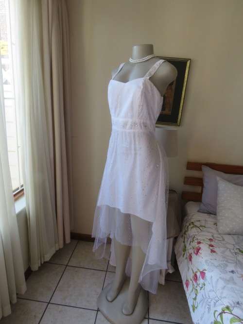 Pretty white strappy evening dress with glitter/embellishment.High/low seamline.Size 36 by GERANO
