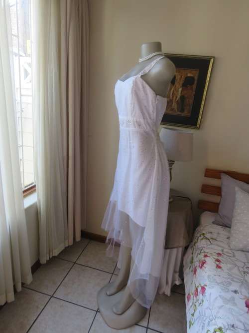 Pretty white strappy evening dress with glitter/embellishment.High/low seamline.Size 36 by GERANO