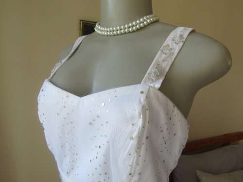 Pretty white strappy evening dress with glitter/embellishment.High/low seamline.Size 36 by GERANO