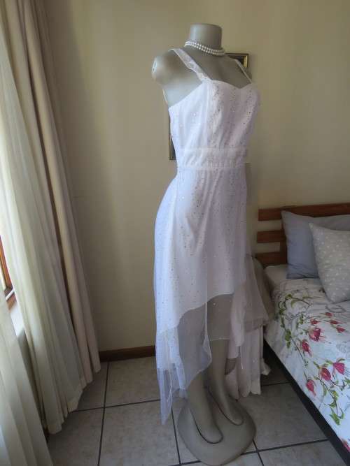 Pretty white strappy evening dress with glitter/embellishment.High/low seamline.Size 36 by GERANO