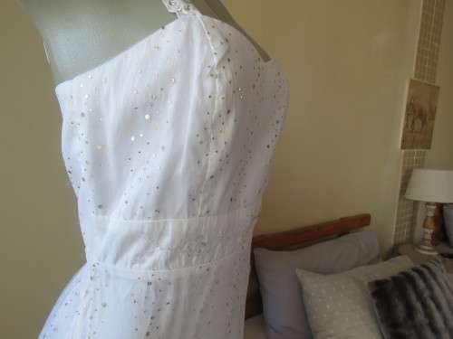 Pretty white strappy evening dress with glitter/embellishment.High/low seamline.Size 36 by GERANO