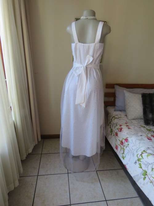 Pretty white strappy evening dress with glitter/embellishment.High/low seamline.Size 36 by GERANO