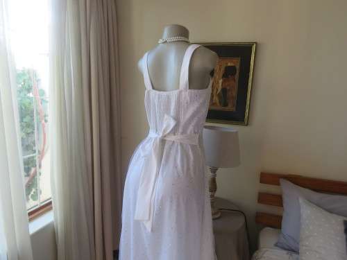 Pretty white strappy evening dress with glitter/embellishment.High/low seamline.Size 36 by GERANO