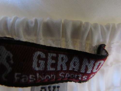 Pretty white strappy evening dress with glitter/embellishment.High/low seamline.Size 36 by GERANO